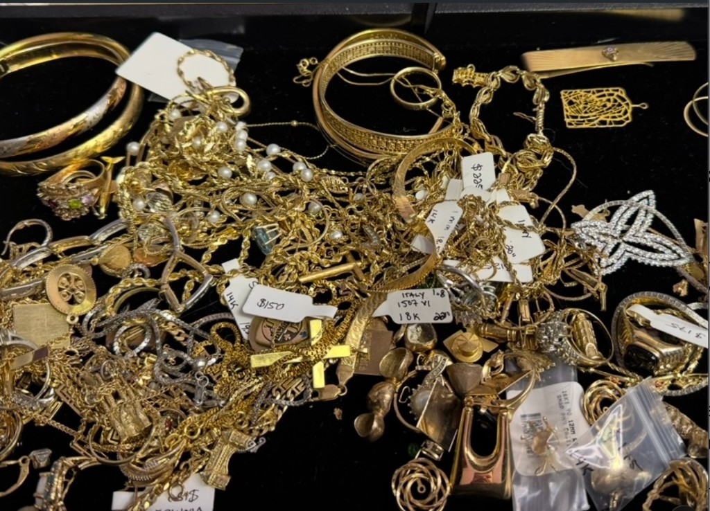 Tray of gold jewelry and estate valuables being sorted and reviewed